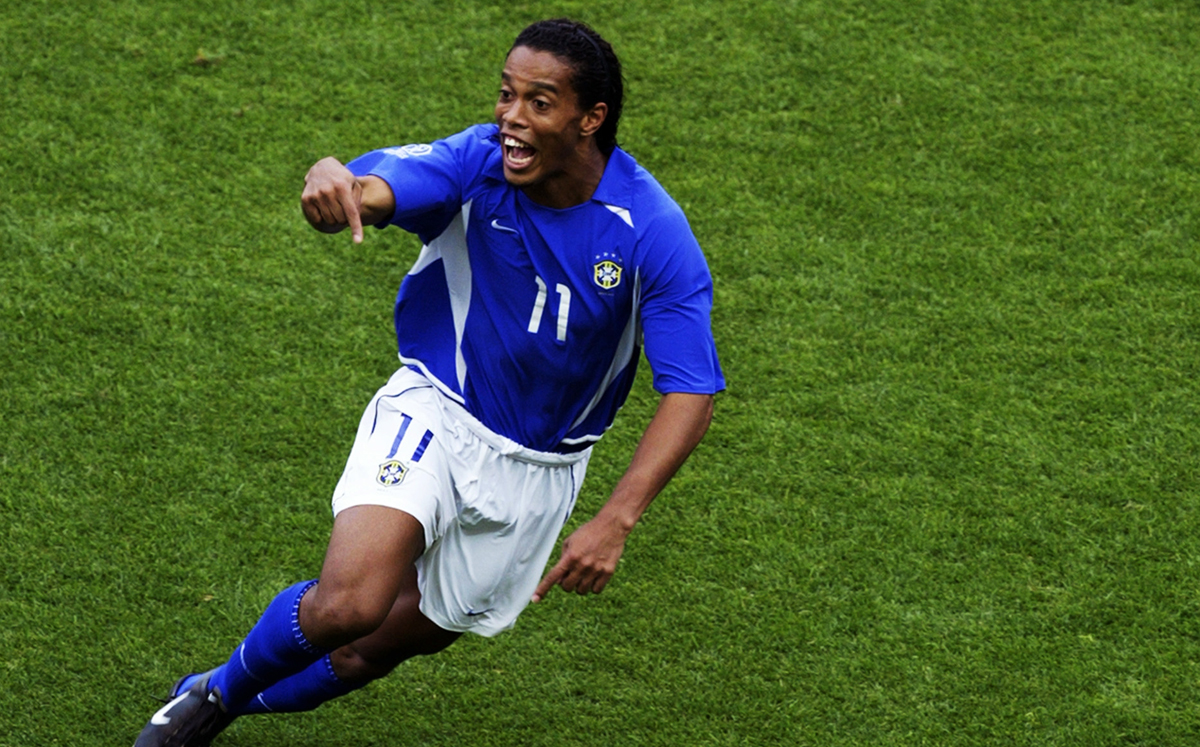 SHIZUOKA - JUNE 21: Ronaldinho of Brazil celebrates after scoring Brazil's second goal during the England v Brazil World Cup Quarter Final match played at the Shizuoka Stadium Ecopa in Shizuoka, Japan on June 21, 2002. Brazil won the match 2-1. (Photo by Laurence Griffiths/Getty Images)