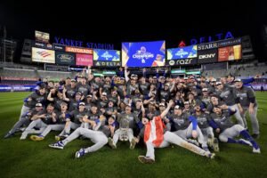 The Los Angeles Dodgers pose for a team picture after their win against the New York Yankees in Game 5 to win the baseball World Series, Thursday, Oct. 31, 2024, in New York. (AP Photo/Ashley Landis)